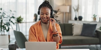 woman, headset in home office with laptop and phone call, remote work and crm in apartment, potential security gap