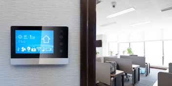 modern office with smart thermostat, security camera, and TV smart devices