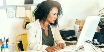 businesswoman looking at computer screen